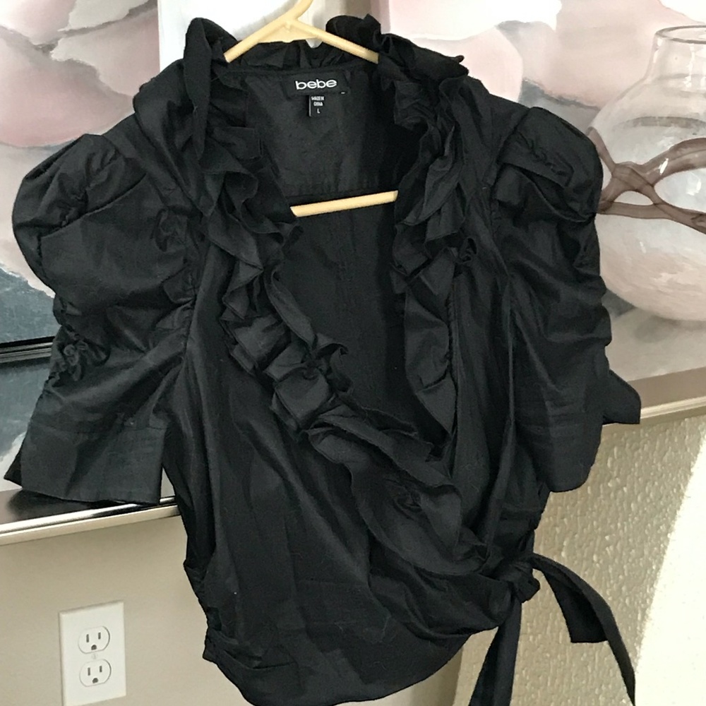 BEBE Wrap around Ruffled Black top or Jacket